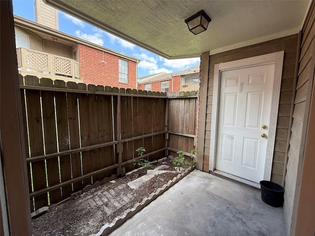 view of patio / terrace featuring fence