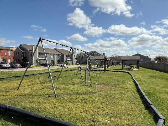 view of yard featuring a residential view and fence