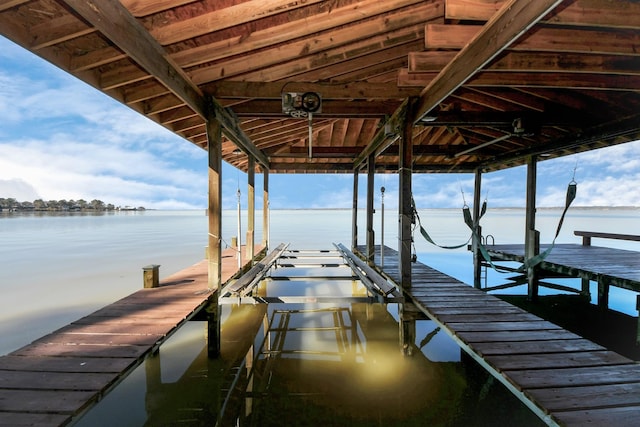 dock area featuring a water view and boat lift