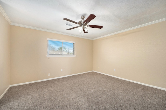 empty room with visible vents, a textured ceiling, carpet flooring, crown molding, and baseboards