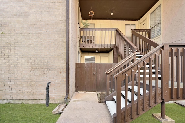 doorway to property with brick siding