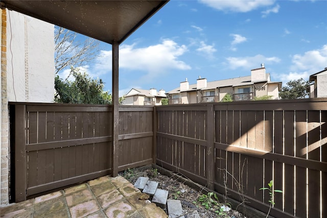 exterior space with a fenced backyard and a residential view