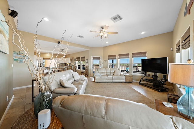 tiled living room with baseboards, recessed lighting, visible vents, and ceiling fan