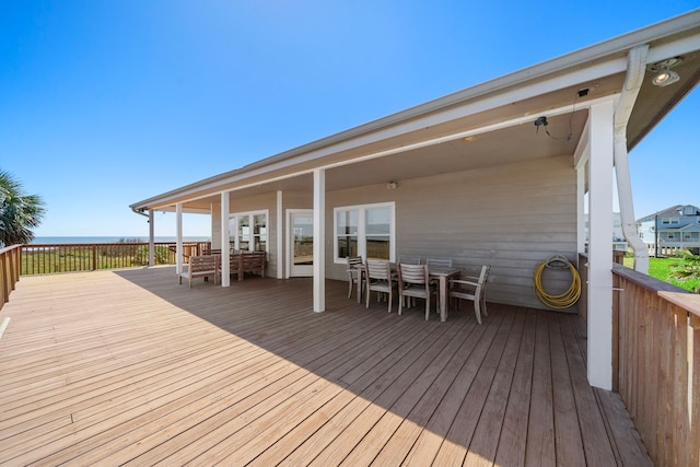 wooden terrace with outdoor dining area