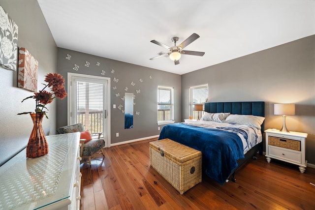 bedroom featuring hardwood / wood-style floors, access to exterior, baseboards, and ceiling fan