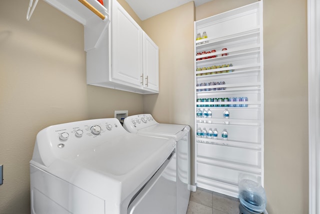 laundry room featuring cabinet space and washing machine and dryer