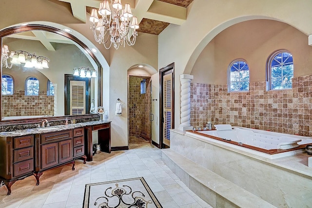 bathroom featuring beam ceiling, a stall shower, coffered ceiling, vanity, and a whirlpool tub