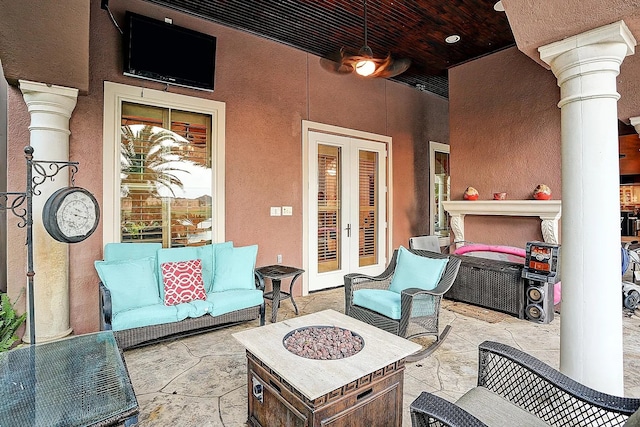 view of patio / terrace featuring french doors and an outdoor fire pit