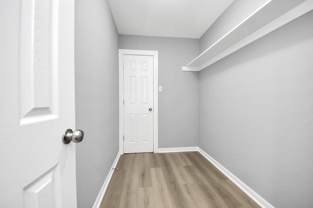 spacious closet with wood finished floors