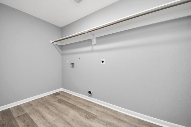 laundry room featuring baseboards, light wood finished floors, hookup for an electric dryer, laundry area, and washer hookup