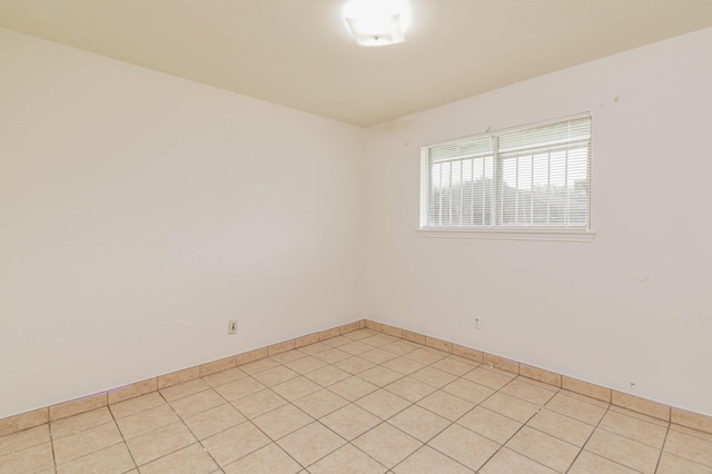 empty room with light tile patterned flooring