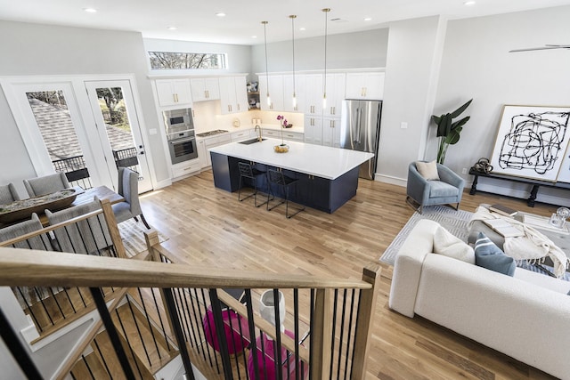 living room featuring recessed lighting and light wood-style flooring