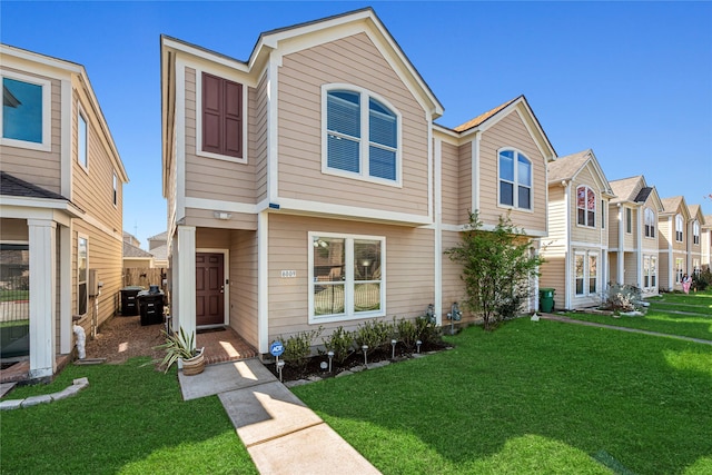 view of property with a residential view and a front yard