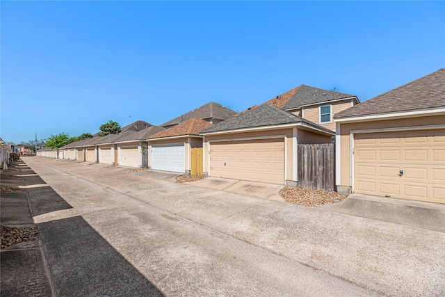 garage featuring fence