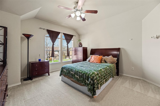 bedroom featuring baseboards, lofted ceiling, and carpet flooring