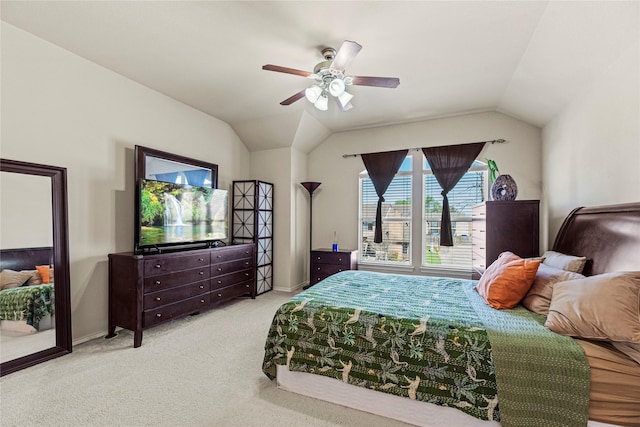 carpeted bedroom featuring baseboards, a ceiling fan, and vaulted ceiling