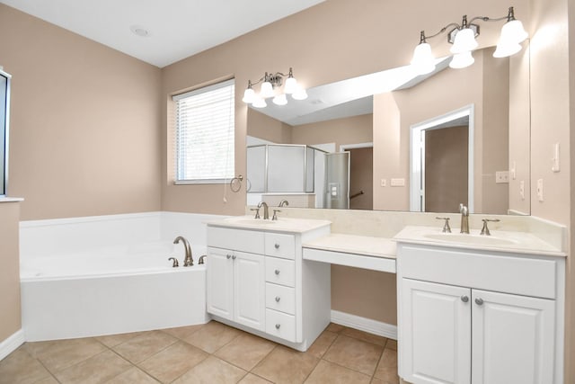 bathroom featuring tile patterned floors, a shower stall, vanity, and a garden tub