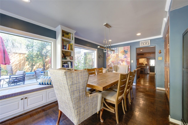 dining room featuring crown molding, recessed lighting, and baseboards