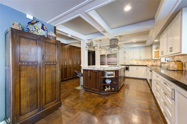 kitchen featuring a sink, backsplash, a kitchen island, white cabinets, and open shelves