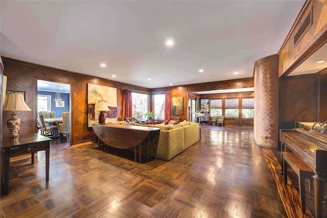 living area with visible vents, recessed lighting, and a healthy amount of sunlight