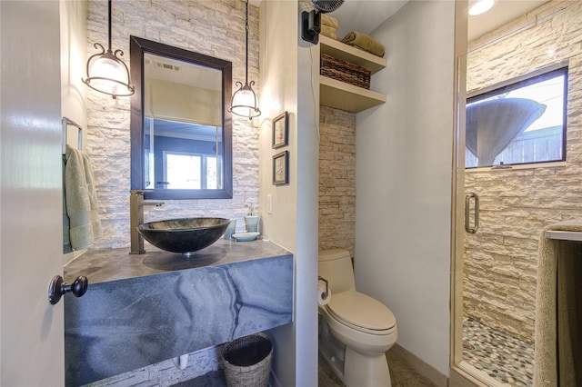 full bathroom with toilet, a shower stall, and vanity