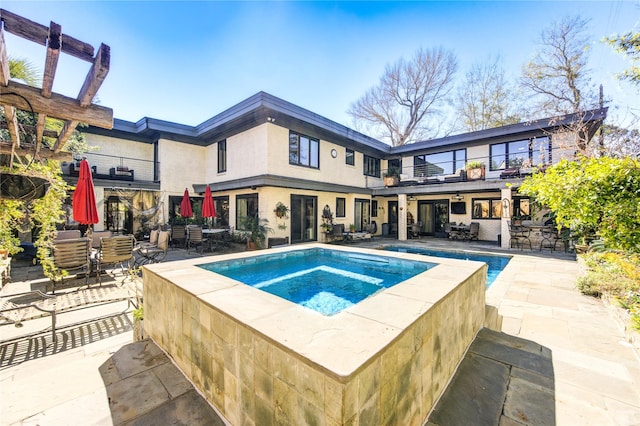 view of swimming pool with a patio and outdoor dining area