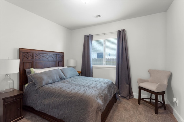 bedroom featuring baseboards and carpet floors