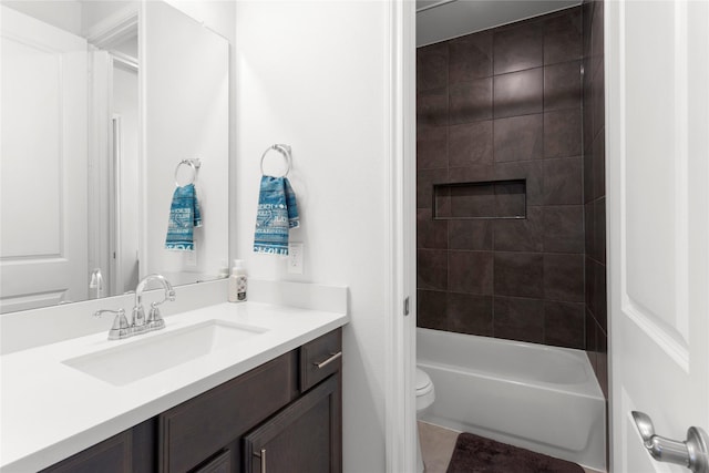 full bath featuring shower / tub combination, tile patterned floors, toilet, and vanity