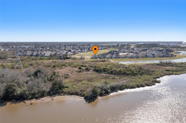 aerial view featuring a residential view and a water view