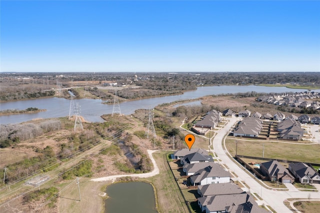 birds eye view of property featuring a residential view and a water view