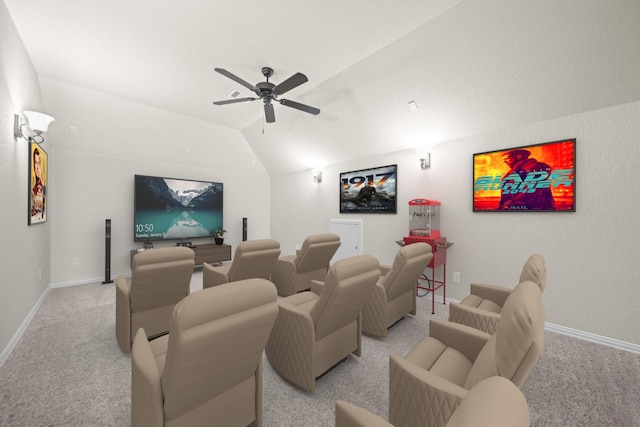 cinema room with light carpet, baseboards, lofted ceiling, and a ceiling fan