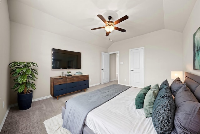 bedroom with a ceiling fan, lofted ceiling, light colored carpet, and baseboards