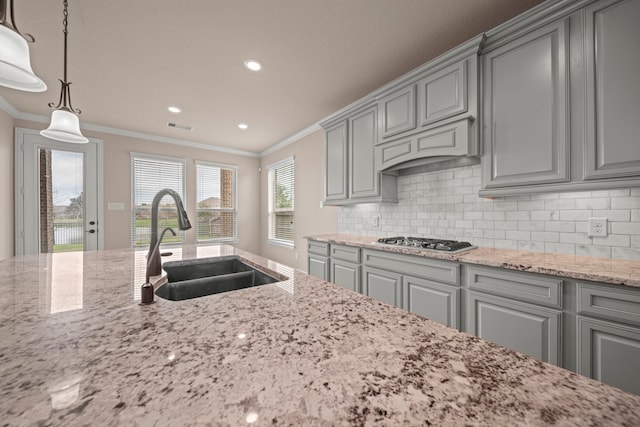 kitchen with a sink, visible vents, gray cabinetry, and stainless steel gas cooktop