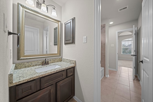 full bathroom featuring visible vents, baseboards, vanity, and tile patterned flooring