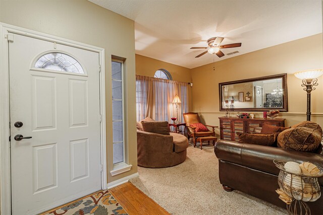 entrance foyer with visible vents, wood finished floors, and a ceiling fan