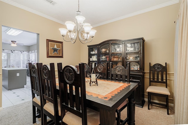 dining room with light tile patterned floors, visible vents, ceiling fan with notable chandelier, and ornamental molding