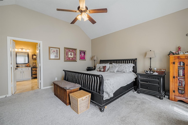 bedroom with light carpet, ceiling fan, baseboards, and lofted ceiling