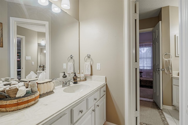 bathroom featuring tile patterned floors and vanity