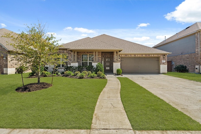 view of front of property featuring brick siding, concrete driveway, roof with shingles, a front yard, and an attached garage