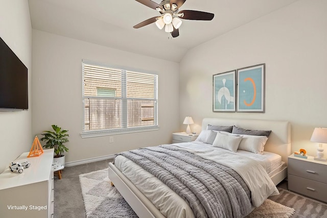 carpeted bedroom featuring baseboards, a ceiling fan, and vaulted ceiling