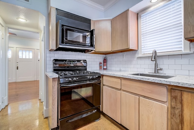 kitchen featuring light stone countertops, ornamental molding, a sink, black appliances, and backsplash