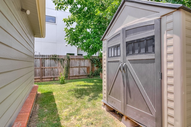 view of shed with fence