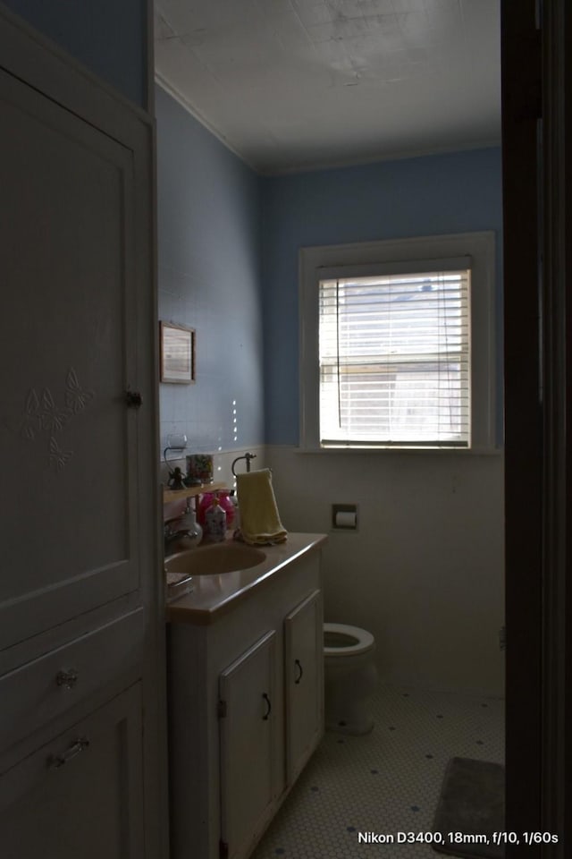 bathroom with tile patterned floors, toilet, and vanity