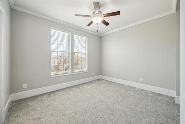 unfurnished room featuring carpet flooring, baseboards, and crown molding