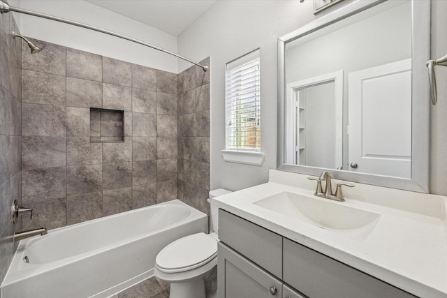 bathroom with vanity, toilet, and bathing tub / shower combination