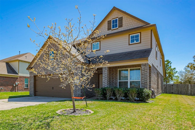 traditional-style home featuring a front yard, an attached garage, fence, and brick siding