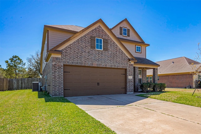 traditional-style house with brick siding, fence, central air condition unit, a front yard, and driveway