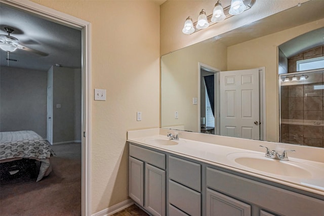 ensuite bathroom with double vanity, a ceiling fan, ensuite bathroom, and a sink