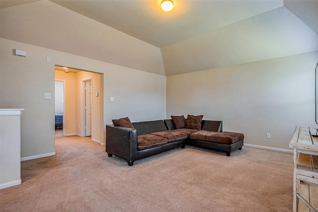 living area featuring baseboards, lofted ceiling, and light colored carpet