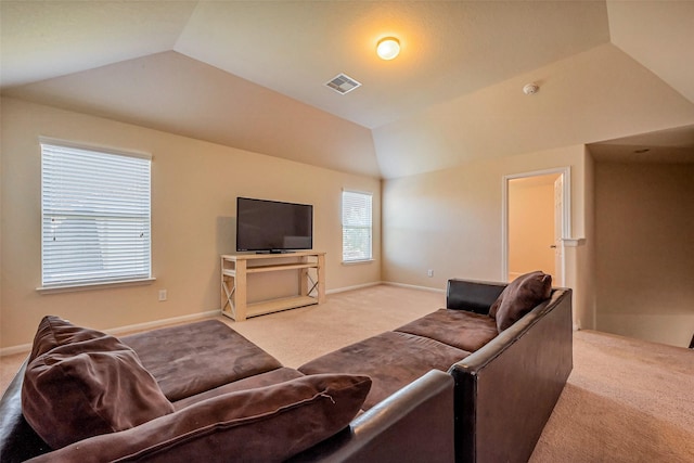 living room featuring lofted ceiling, light colored carpet, visible vents, and baseboards